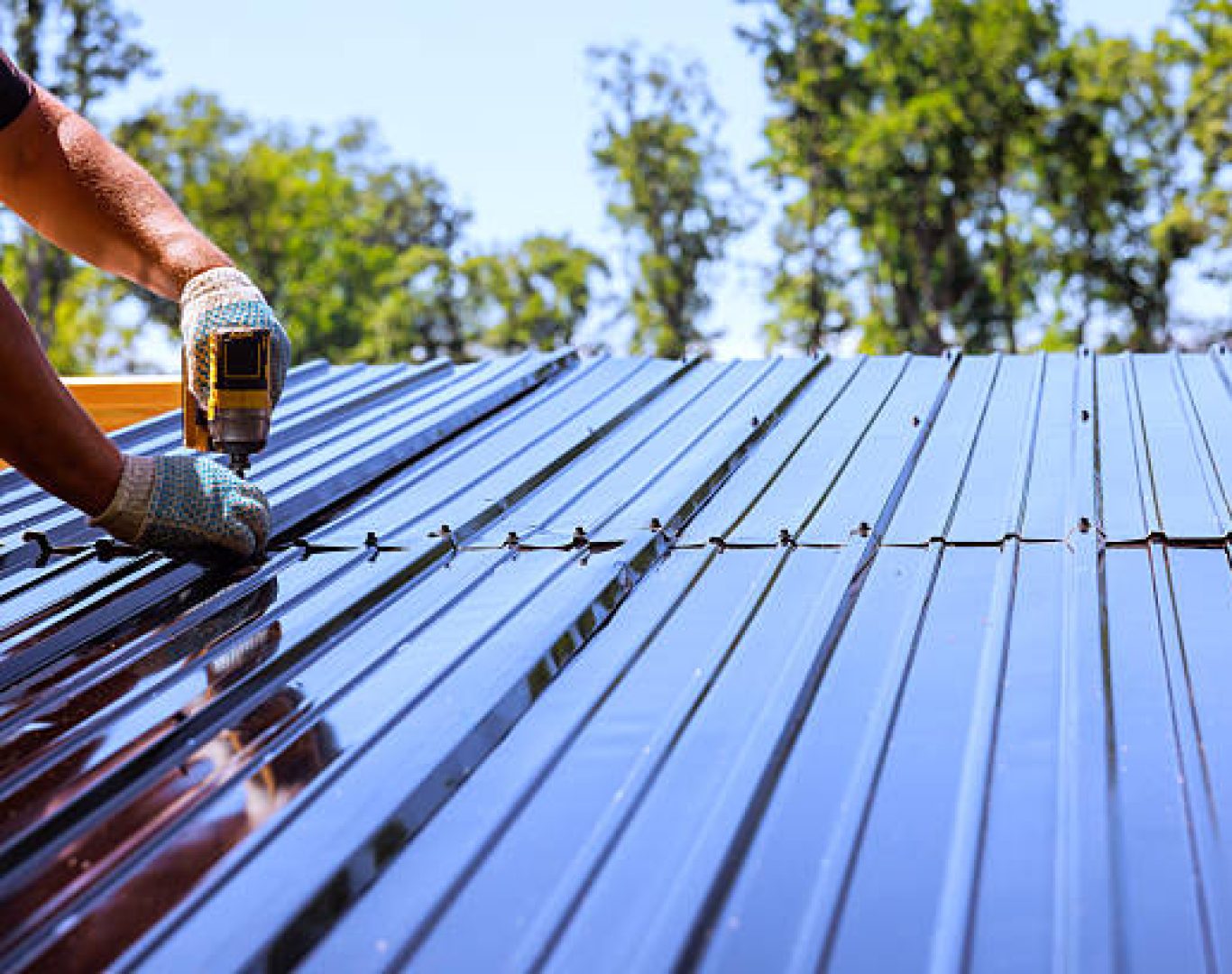 Inspector reviewing Metal Roofing details on a Cupertino, CA home near flashing and roof penetrations
